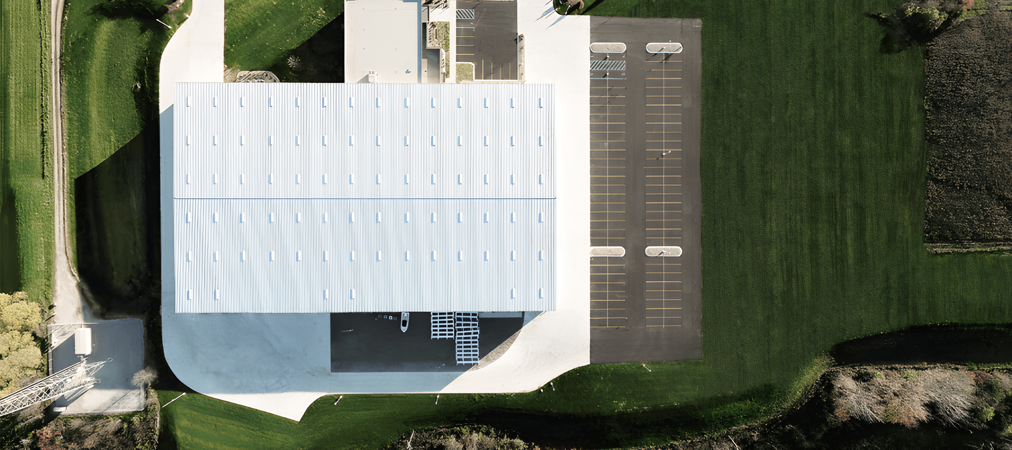 Performance Fabrication aerial view of the white metal roof with skylights